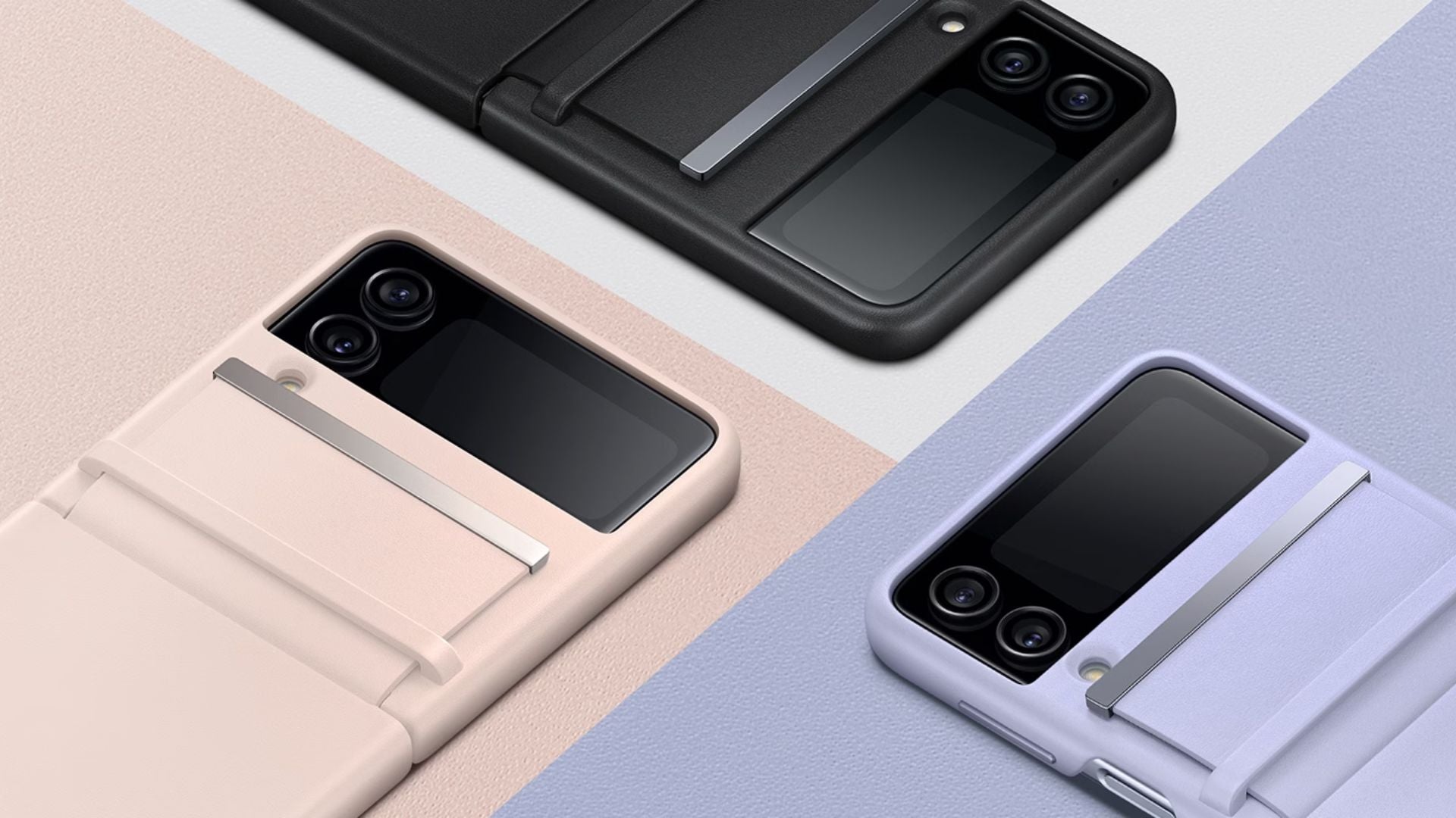 Three foldable smartphones in black, pink, and lavender protective cases are displayed diagonally on color-blocked backgrounds. Each phone features a small external screen and dual rear cameras.