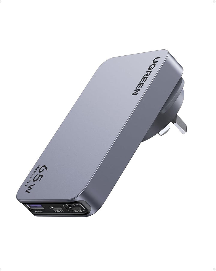 The UGREEN 65W Travel Charger, Nexode Pro 3-Port GaN, features a sleek silver design with foldable plug, USB-C and USB-A ports for fast charging, and displays "UGREEN" branding. Ultra-slim and ideal for travel.