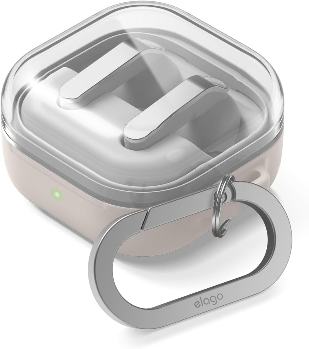 A clear, square silicone TPU case with rounded edges for Samsung Galaxy Buds 4 Pro/4, featuring a light beige base, transparent lid, green LED indicator, an oval metallic carabiner engraved "elago," and wireless charging compatibility by MobileTechnica.