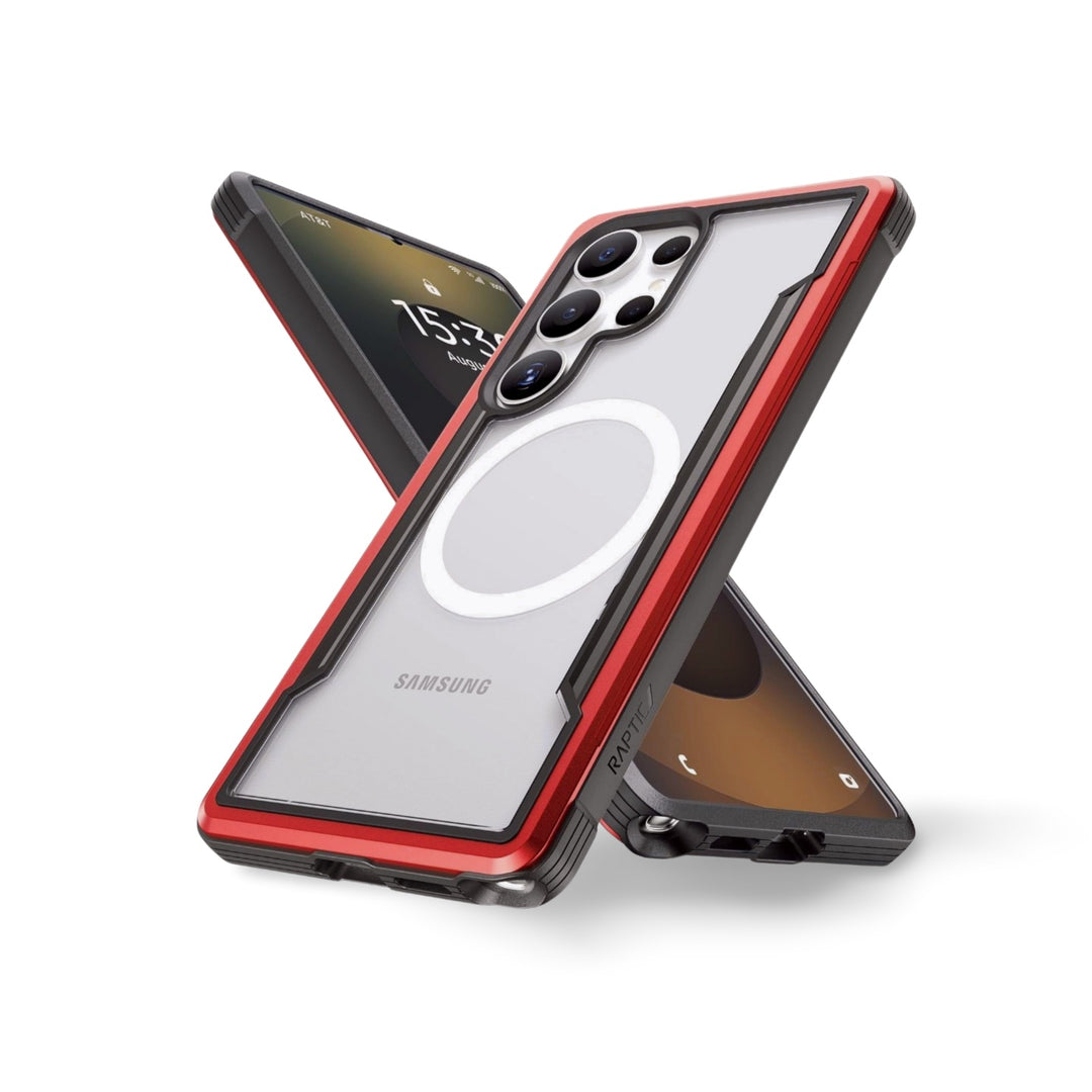 Two Samsung S25 smartphones in red-bordered Raptic Shield cases are arranged in an X shape—one shows the triple camera, the other the 15:41 screen—blending military-grade protection with a sleek design.