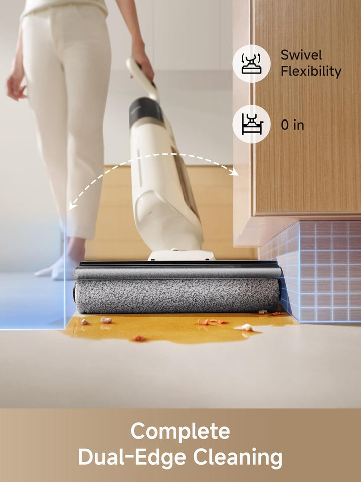 A person uses the MobileTechnica MOVA K30 Wet Dry Vacuum Cleaner (18k Pa Suction) with dual-edge cleaning and swivel flexibility to clean orange liquid by a kitchen cabinet, showcasing efficient edge cleaning. Text: “Complete Dual-Edge Cleaning.”.