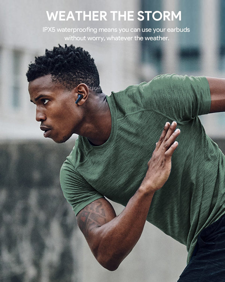 A focused man in a green athletic shirt runs outdoors, wearing Aukey MiniNC Active Noise Cancelling Earbuds. Text above reads, “WEATHER THE STORM. IPX5 waterproofing and ANC keep your music and calls clear—rain or shine.” Background is blurred.