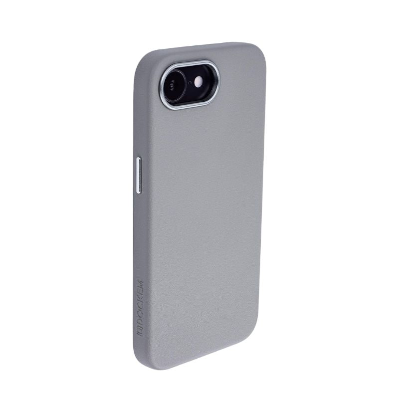 The Dockem iPhone 16e Synthetic Leather Magnetic Case - Apex MagSafe, in light gray with a smooth finish, offers slim protection and precise cutouts for camera, flash, and side button. "MOCASE" is subtly embossed near the bottom.