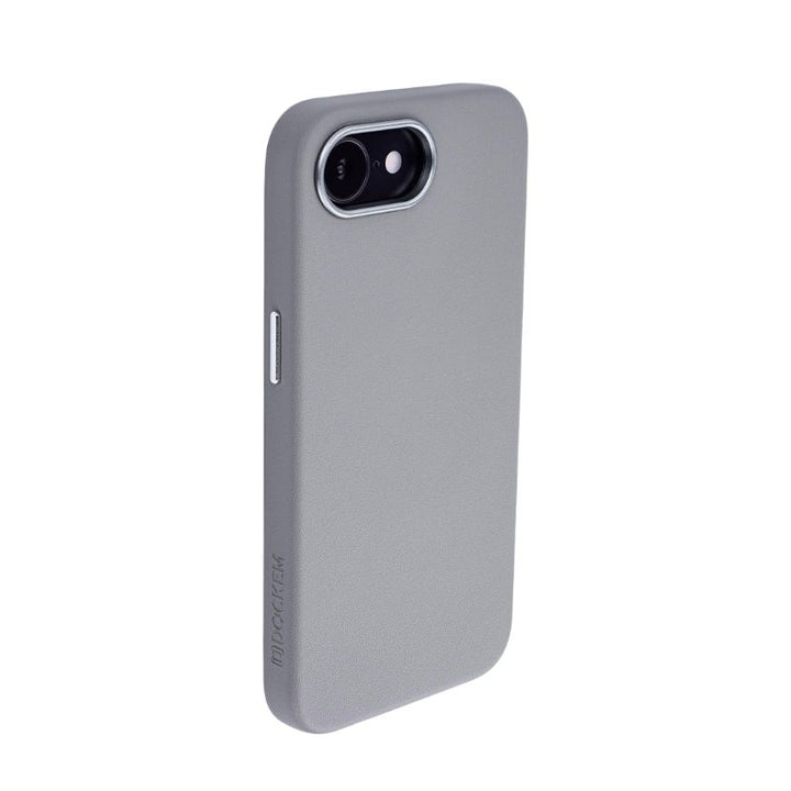 The Dockem iPhone 16e Synthetic Leather Magnetic Case - Apex MagSafe, in light gray with a smooth finish, offers slim protection and precise cutouts for camera, flash, and side button. "MOCASE" is subtly embossed near the bottom.