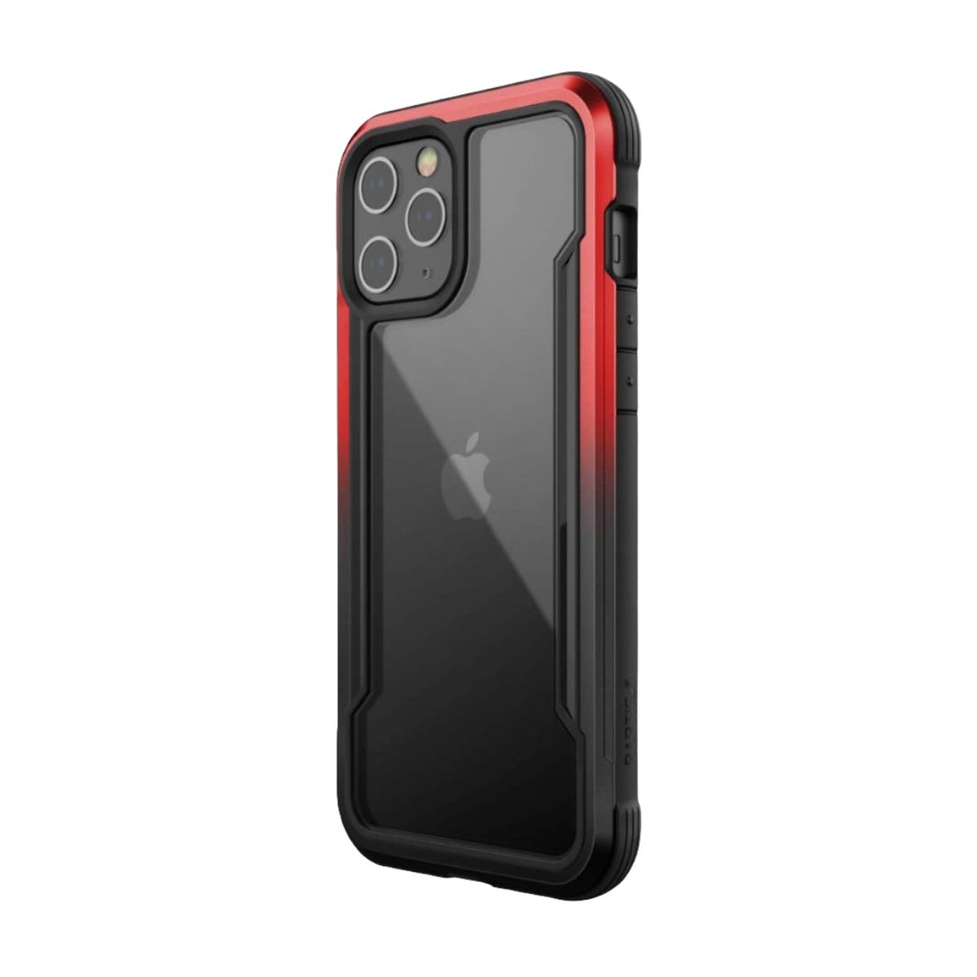 A black and red iPhone 12 Pro Max Case - Raptic Shield with a clear back, protecting a black iPhone inside it. The Raptic Shield case offers military-grade protection with reinforced edges and covers the phone's buttons and camera. Drop tested for ultimate durability.