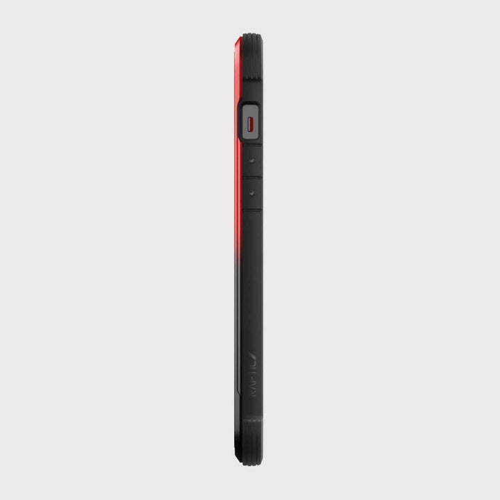 Side view of a black and red smartphone with visible power and volume buttons, featuring the Raptic iPhone 12 Pro Max Case - Raptic Shield for military-grade protection.