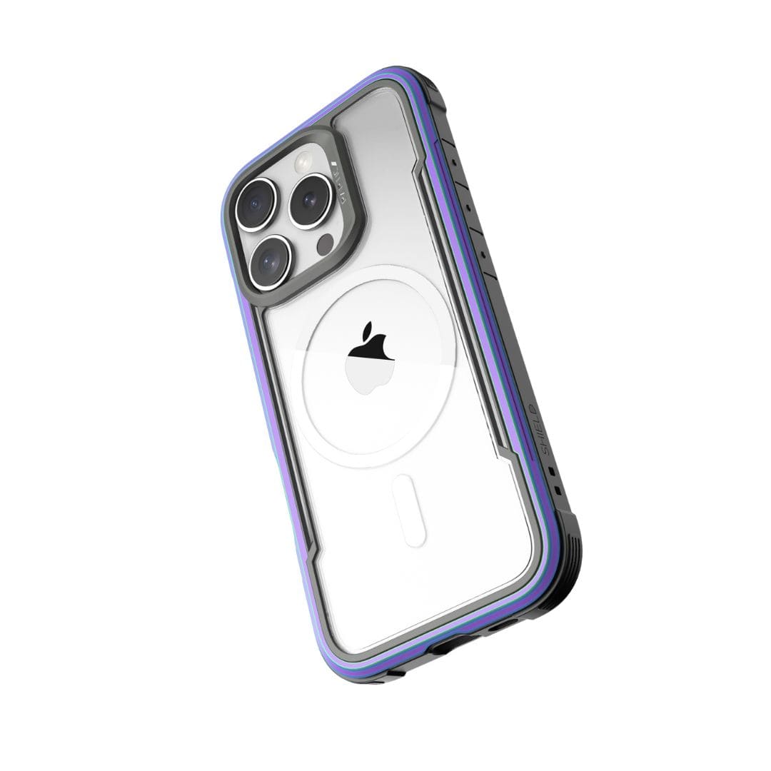 A smartphone with a transparent case featuring a purple border is shown from the back. The phone has three camera lenses in the top left corner, and the Apple logo is visible in the center. The Raptic Shield MagSafe Case for iPhone 16 Pro has reinforced corners, offers drop protection, and maintains a sleek, durable design.