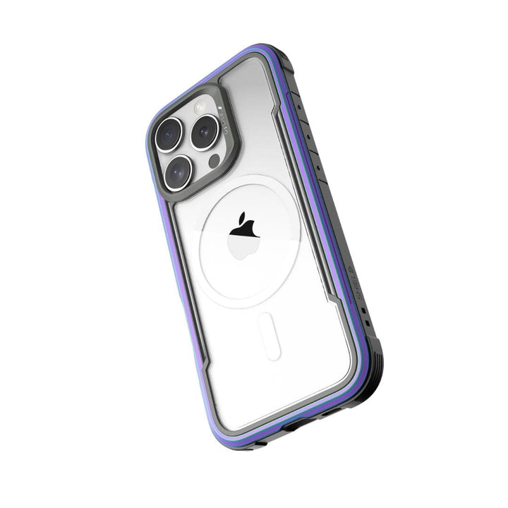 A smartphone with a transparent case featuring a purple border is shown from the back. The phone has three camera lenses in the top left corner, and the Apple logo is visible in the center. The Raptic Shield MagSafe Case for iPhone 16 Pro has reinforced corners, offers drop protection, and maintains a sleek, durable design.