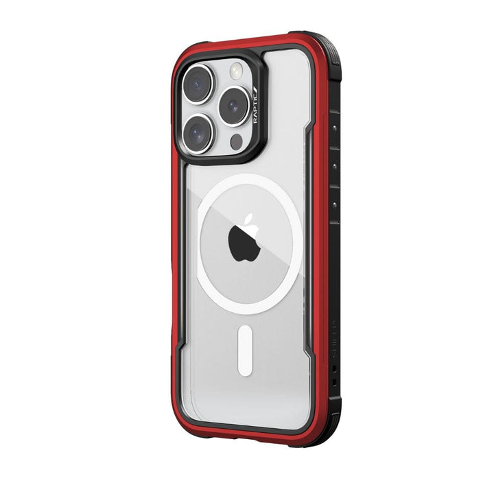 A close-up of the Raptic Shield MagSafe Case for iPhone 16 Pro shows its rugged, wireless charging compatible design. The case boasts a sleek red and black aesthetic with reinforced corners and a clear back revealing the Apple logo. The phone's camera module with multiple lenses is visible at the top left, ensuring drop protection.