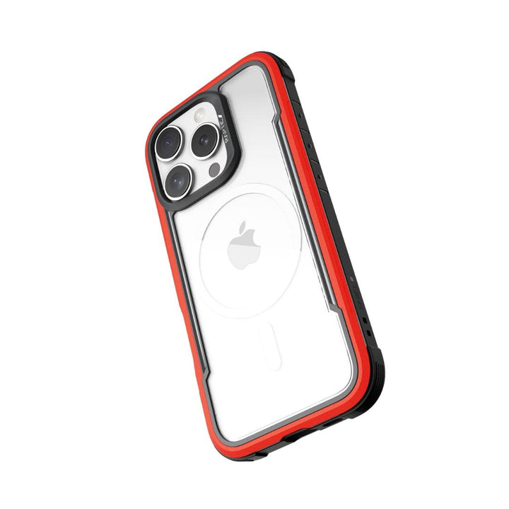 A smartphone in a Raptic Shield MagSafe Case for iPhone 16 Pro featuring a transparent back and red accents. The phone's rear camera has three lenses, and the Apple logo is visible through the clear case. With black side bumpers, raised edges, drop protection, and wireless charging compatibility, it ensures total device safety.