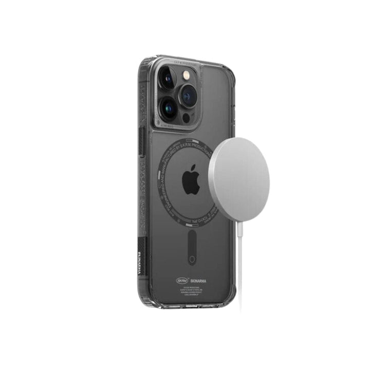 iPhone 14 Pro Max SAIDO Case - Skinarma with a built-in MagSafe compatible ring showcases the back of an iPhone while offering 360 full protection and holding a circular magnetic charger.