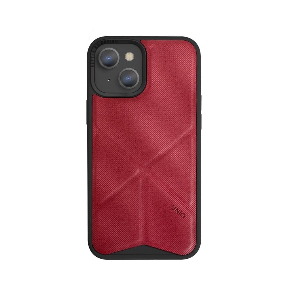 An iPhone 13 UNIQ Transforma MagSafe Folding Case with a smooth texture and drop protection covers the phone. The case features a black border and sleek, angled lines on the back design. The phone's dual camera and flash are visible in the upper left corner, while the brand name "UNIQ" is printed on the lower right corner.