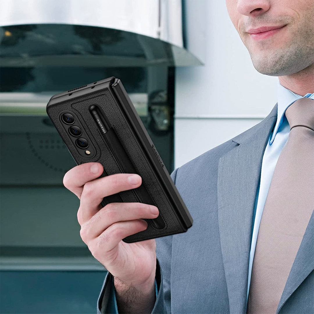 A man in a suit holding a Urban phone in front of an oven, compatible with Samsung Galaxy Z Fold 5 Kickstand Case with Pen Holder - Urban edition and wireless charging compatible.