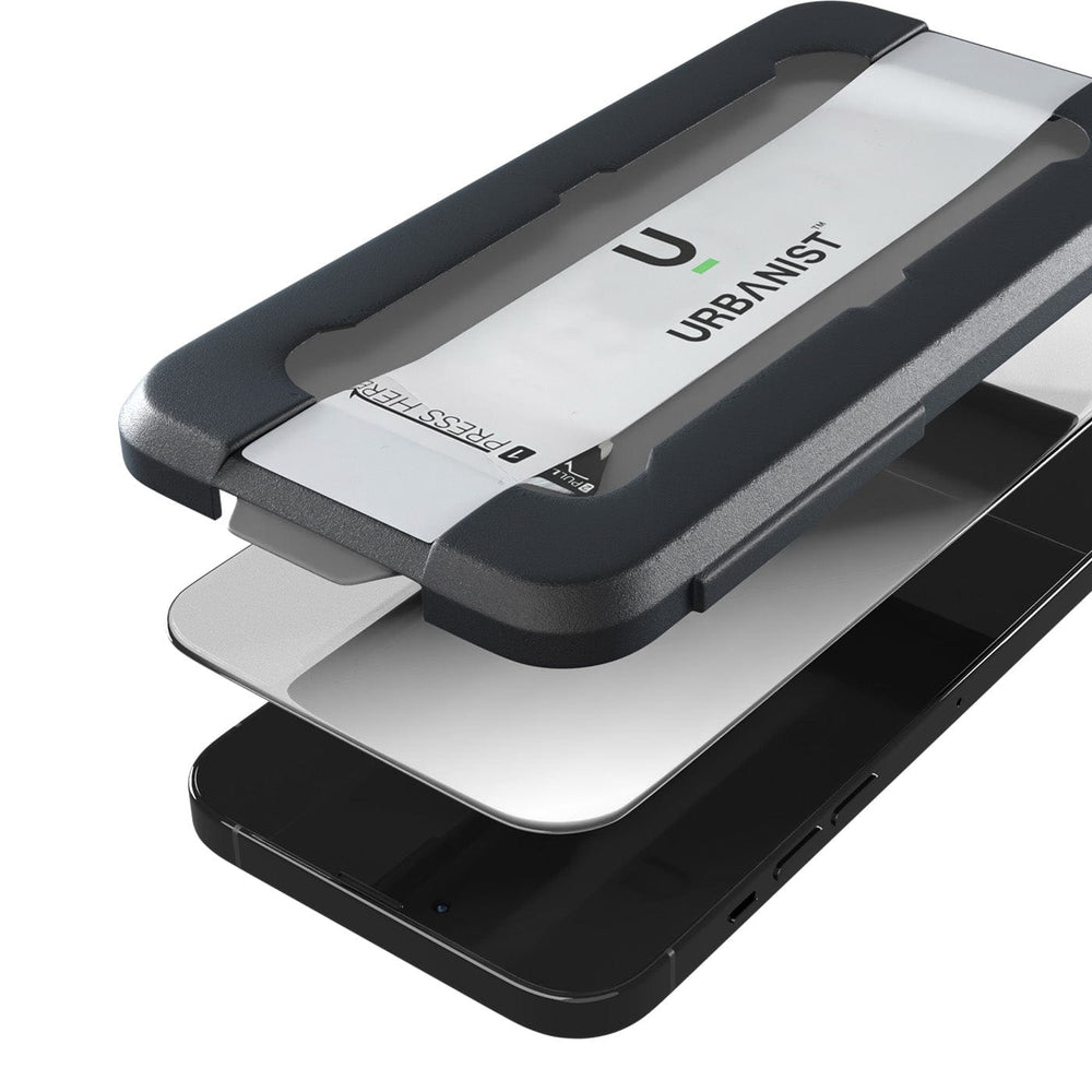 A Samsung Galaxy S23 FE smartphone with an Urban Screen Protector partially attached to the display using a black and gray alignment tool labeled "Urban," offering Diamond Tempered Glass for premium screen protection.