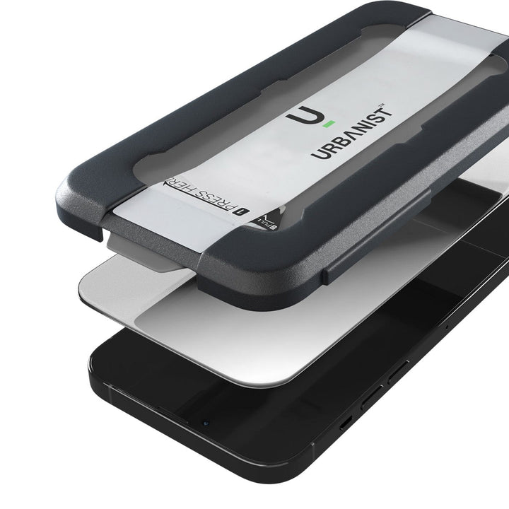 A Samsung Galaxy S23 FE smartphone with an Urban Screen Protector partially attached to the display using a black and gray alignment tool labeled "Urban," offering Diamond Tempered Glass for premium screen protection.